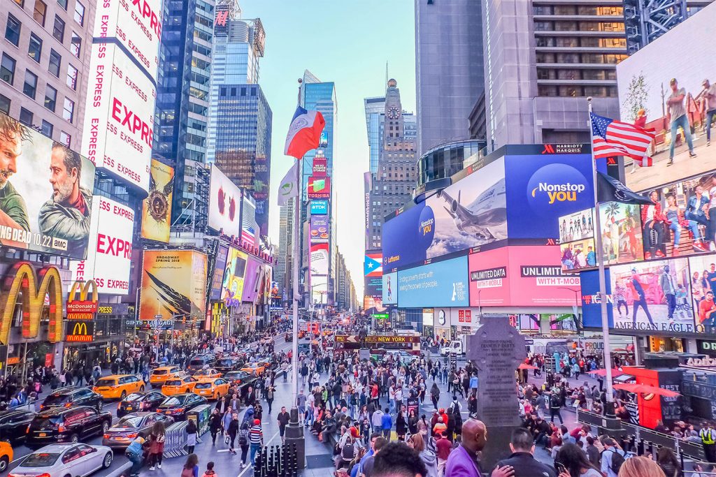 A colorful wide shot of Times Square in New York City